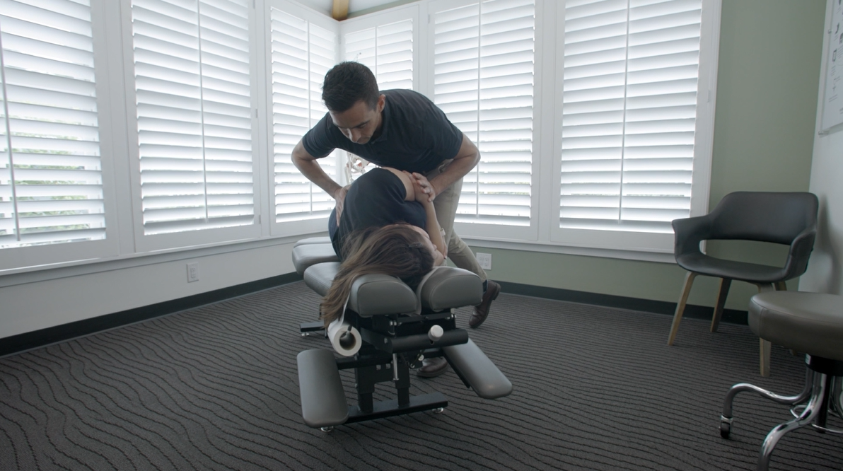 Dr. Rion Zimmerman performing spinal adjustment